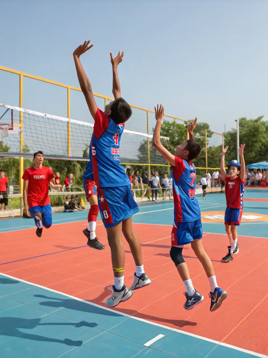 A dynamic action shot of young volleyball players participating in a training session at Gymnase Babeth Bertaud, focusing on teamwork and skill development.